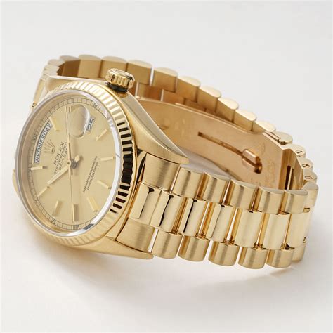 rolex day date gold watch